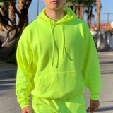 Chándal de moda para hombre de estilo verde neón Sólido 2 piezas Sudadera con capucha de manga larga + Pantalones de chándal sueltos Traje deportivo casual Hombres 2019 El más nuevo OMSJ