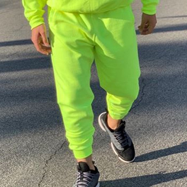 Chándal de moda para hombre de estilo verde neón Sólido 2 piezas Sudadera con capucha de manga larga + Pantalones de chándal sueltos Traje deportivo casual Hombres 2019 El más nuevo OMSJ